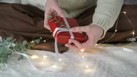 A gift eucalyptus branch for Christmas or Valentine's day on the bed Stock Footage 170556355
