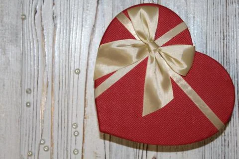 Gift of the heart on a old table Stock Photos