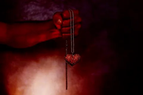 A gift from hell, heart in hand 스톡 사진