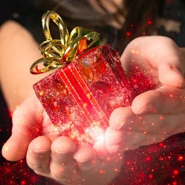 Gift in her hands with particles Stock Photos