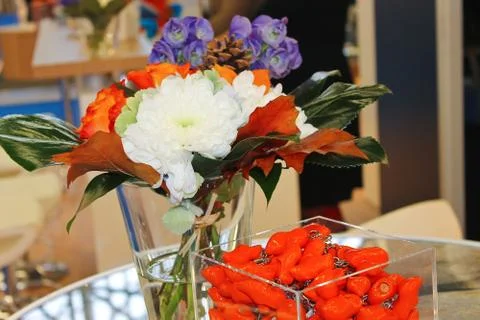 Gift keychains and flowers in interior office Stock Photos
