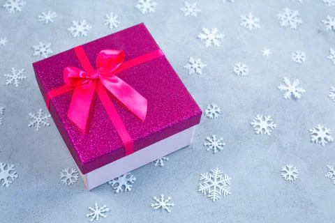 Gift or present box and snowflakes with copy space Stock Photos