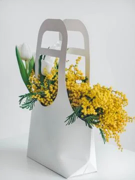 Gift or present box with flowers. Greeting card. International Women day. Stock Photos