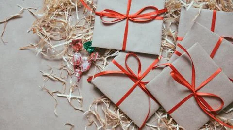 Gift or present box wrapped in kraft paper Stock Photos