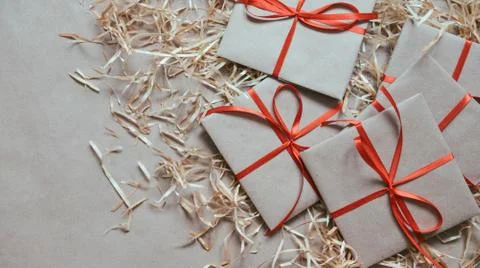 Gift or present box wrapped in kraft paper Stock Photos