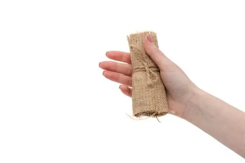 Gift in original package, bag with sack of burlap, surprise in woman's hand. Stock Photos