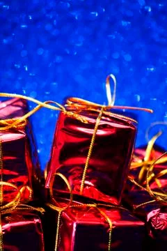 Gift packages on bright blue background Stock Photos