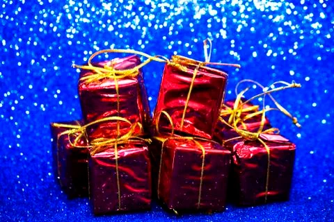 Gift packages on bright blue background Foto stock