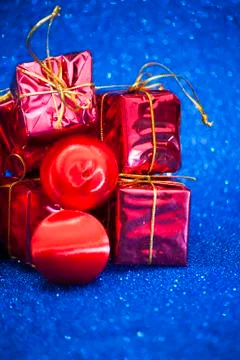 Gift packages on bright blue background Stock Photos