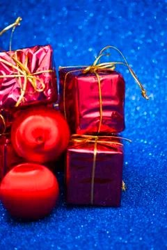 Gift packages on bright blue background Stock Photos