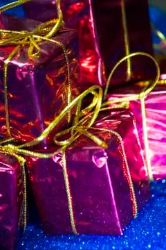 Gift packages on bright blue background Stock Photos