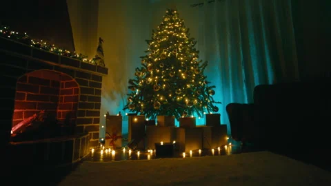 Gift packages at night with a Christmas tree in the living room home Stock Footage 320393106