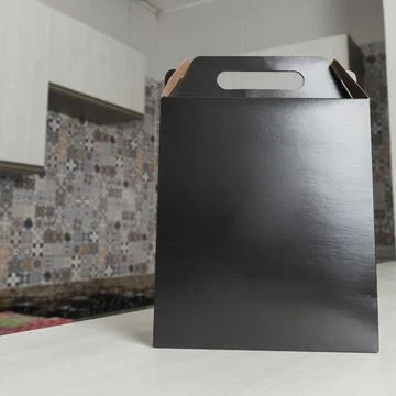 Gift packaging on the wooden table with space for advertising and copy space. Fotos Stock