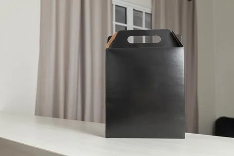 Gift packaging on the wooden table with space for advertising and copy space. Fotos Stock