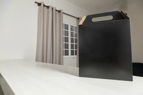 Gift packaging on the wooden table with space for advertising and copy space. 스톡 사진