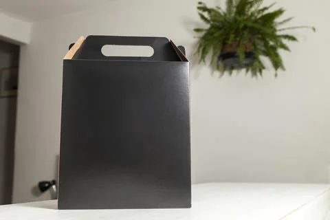 Gift packaging on the wooden table with space for advertising and copy space. Fotos Stock