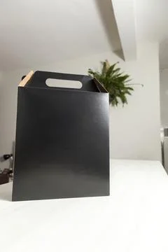 Gift packaging on the wooden table with space for advertising and copy space. Fotos de archivo