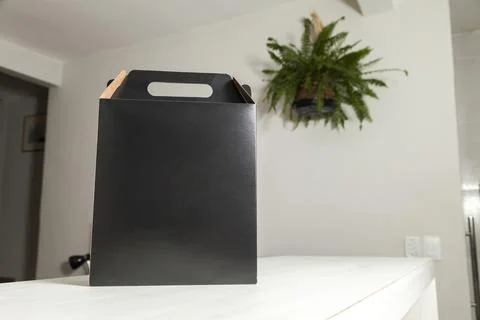 Gift packaging on the wooden table with space for advertising and copy space. Stockfoto's