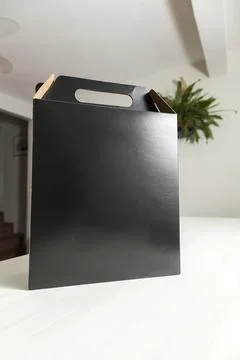 Gift packaging on the wooden table with space for advertising and copy space. Stock-Fotos