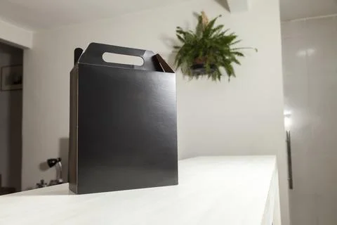 Gift packaging on the wooden table with space for advertising and copy space. Fotos de archivo
