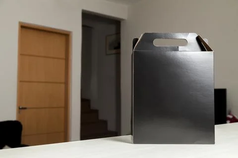 Gift packaging on the wooden table with space for advertising and copy space. Fotos Stock