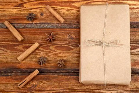 Gift Packed in eco-friendly biodegradable cardboard on dark old wooden backgr Stock Photos