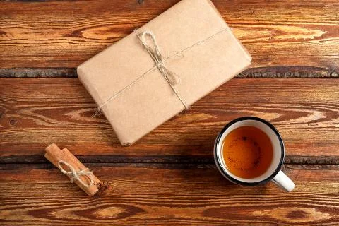 Gift Packed in eco-friendly biodegradable cardboard and a glass of tea on a d Stock Photos