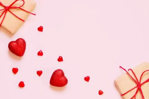 A gift on a pink background with decorations. The concept of the St. Valentin Stock Photos