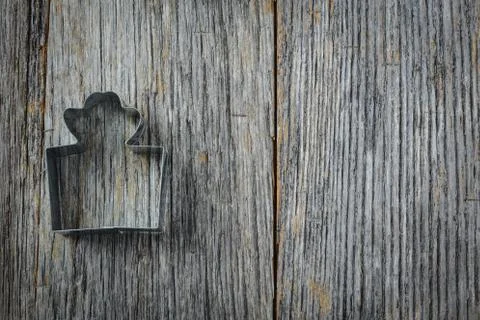 Gift present cookie cutter on rustic wood background Stock Photos