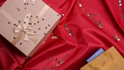 Gift on a red background. Assorted holiday boxes with bows for any holiday Stock Footage 146648053