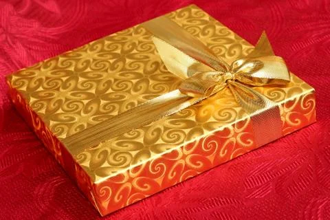 Gift on a red background Stock Photos