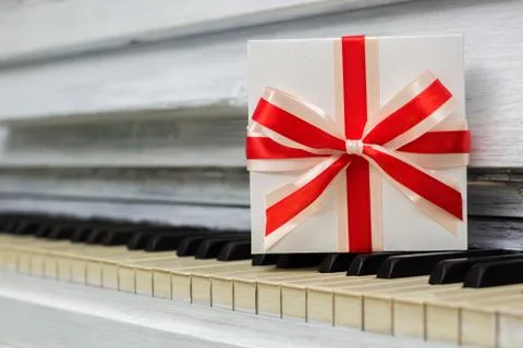 Gift with a red bow is on the keys Stock Photos