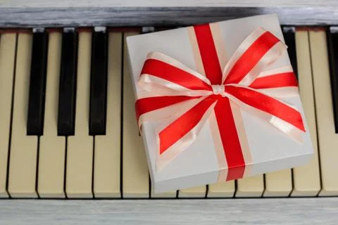 Gift with a red bow is on the keys Stock Photos