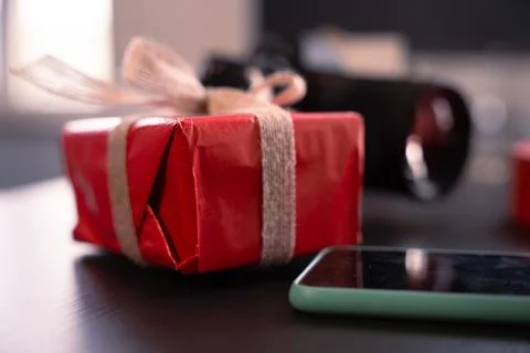 Gift red box with bow on the table.Lovers Stock Photos