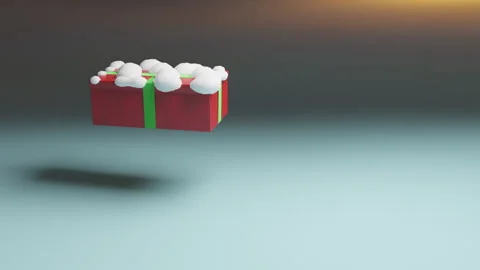 Gift in red box with snow and green ribbons jumping in the air. Loop. Stock Footage 166313812
