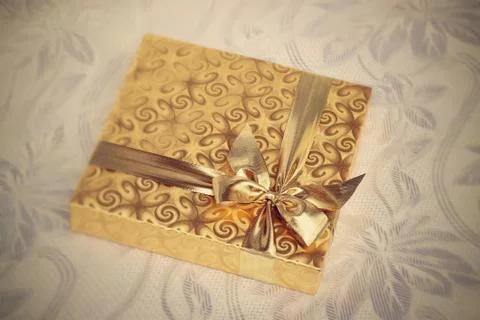 Gift on a retro background Stock Photos