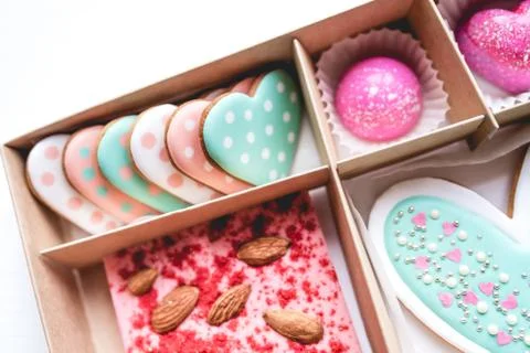 Gift set with hand made sweets in a box on a white table. Stock Photos