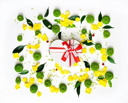 Gift in shape of heart with pattern from petals. Stock Photos