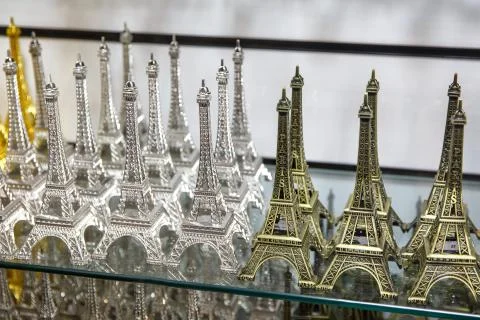 Gift shop in Paris. Small copies of the Eiffel tower. Stock Photos