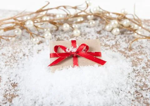 Gift on snow Stock Photos