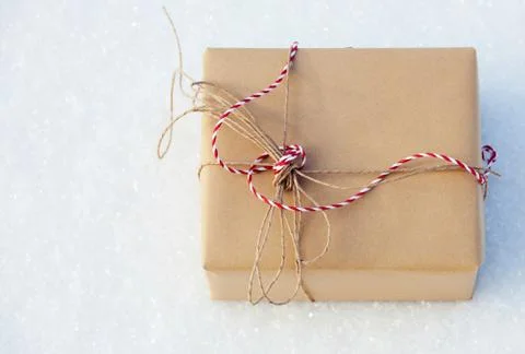 Gift on snow Stock Photos