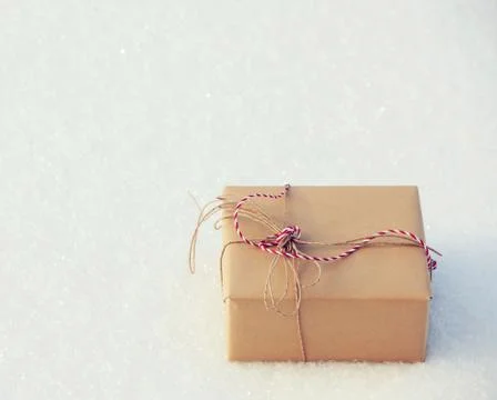 Gift on snow Stock Photos