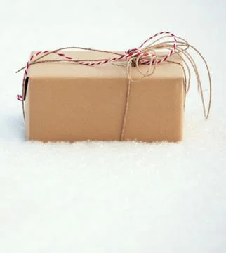 Gift on snow Stock Photos