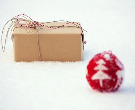 Gift on snow Stock Photos