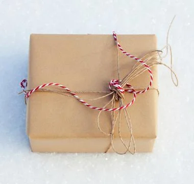 Gift on snow Stock Photos
