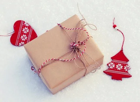 Gift on snow Stock Photos