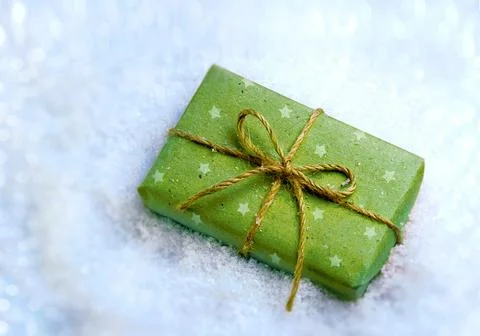 Gift in snow Stock Photos