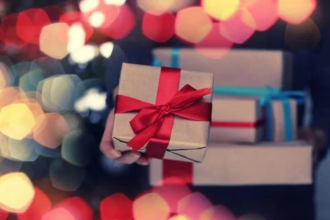 Gift stack hand christmas New Year s Eve celebration package gifts and sig... Stockfoto's
