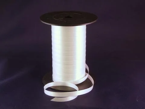 Gift strings on plastic reels. Stock Photos