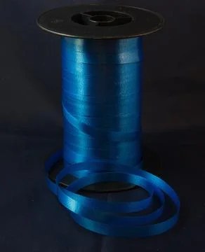 Gift strings on plastic reels. 写真素材